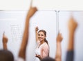 Who knows the answer. A group of students raising their hands in class. Royalty Free Stock Photo