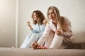 Who needs beauty salons when you can make one at home. Portrait of two best friends sitting in room and painting Royalty Free Stock Photo