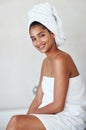 Who said you cant pamper yourself everyday. Portrait of an attractive and relaxed young woman wrapped in a towel at home Royalty Free Stock Photo