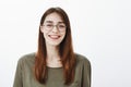 Who says glasses for nerds. Portrait of happy good-looking friendly woman in trendy eyewear, smiling broadly and