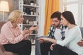 Unhappy aged woman talking to her son