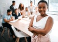 Who wouldnt wanna be a part of this team. Cropped portrait of an attractive young businesswoman attending a meeting in Royalty Free Stock Photo