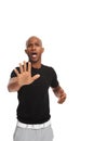 Whoa, not so fast. Studio shot of a upset african american man making a stopping gesture at the camera isolated on white