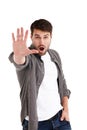 Whoa there. Studio portrait of a young man holding up his hand telling you to stop.