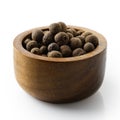 Whole allspice in dark wood bowl. Royalty Free Stock Photo