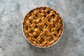 Whole apple pie, in white ceramic baking pan, top view Royalty Free Stock Photo