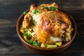 Whole baked chicken with mushrooms and potatoes in a baking dish on a table. Baked turkey. Christmas dish. Easter