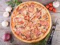 Whole baked pizza with bacon Royalty Free Stock Photo