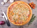 Whole baked pizza on a board Royalty Free Stock Photo