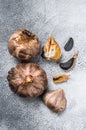 Whole balsamic fermented black garlic. White background. Top view