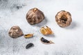 Whole balsamic fermented black garlic. White background. Top view Royalty Free Stock Photo