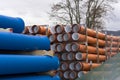 New plastic sewage and water pipes arranged on pallets on the construction site. Royalty Free Stock Photo