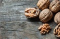 Whole big peeled walnut kernel with thin shell on wooden background Royalty Free Stock Photo