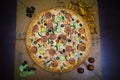 A whole big pizza close-up on a gray background. Colorful pizza topping Royalty Free Stock Photo