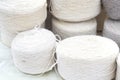 Whole big wheels of natural wool rolls used for the production of woolen socks Royalty Free Stock Photo