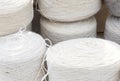 Whole big wheels of natural wool rolls used for the production of woolen socks Royalty Free Stock Photo