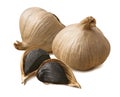 Whole black garlic bulbs and cloves isolated on white background Royalty Free Stock Photo