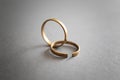 Whole and broken rings on grey background. Concept of divorce Royalty Free Stock Photo