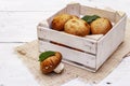 Whole brown royal champignon mushrooms in crafted wooden crate Royalty Free Stock Photo