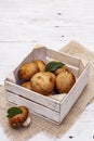 Whole brown royal champignon mushrooms in crafted wooden crate Royalty Free Stock Photo