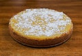 A whole cheesecake resting on a table Royalty Free Stock Photo