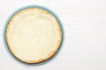 Whole cheesecake on a wooden white table. Top view. Copy space Royalty Free Stock Photo