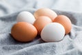 Whole chicken eggs on kitchen napkin