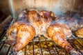 Whole chicken smoked in electric bbq smoker Royalty Free Stock Photo