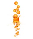Whole and chopped fresh oranges are falling down through splashes of juice Royalty Free Stock Photo