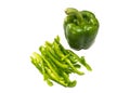 Whole and chopped green capsicums Royalty Free Stock Photo