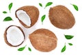 Whole coconut with half decorated with leaves isolated on white background. Flat lay. Top view Royalty Free Stock Photo