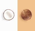 Whole coconut and half coconut on white and brown creative background Royalty Free Stock Photo