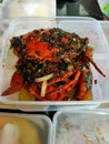 Whole crab cooked covered with black pepper sauce Royalty Free Stock Photo