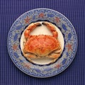 Whole crab on decorative plate