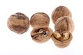 Whole and cracked walnuts isolated on white background Royalty Free Stock Photo
