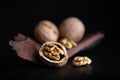 Whole and cracked walnuts with kernels Royalty Free Stock Photo