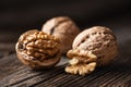 Whole and cracked walnuts with kernels Royalty Free Stock Photo