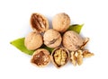 Whole and cracked walnuts on a white background Royalty Free Stock Photo