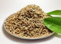 Whole cumin seeds isolate white background.