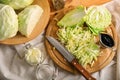 Whole and cut fresh cabbage on wooden table Royalty Free Stock Photo