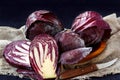 Whole And Cut In Half Fresh Red Cabbage In A Wooden Plate on Dark Background Royalty Free Stock Photo