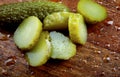 Whole and cut pickled cucumbers. Salted cucumbers