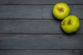 Whole and cut red and green ripe apples autumn harvest and apple juice, from above on dark grey wooden table Royalty Free Stock Photo