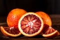 Whole and cut ripe juicy Sicilian Blood oranges Royalty Free Stock Photo