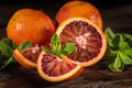 Whole and cut ripe juicy Sicilian Blood oranges Royalty Free Stock Photo