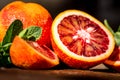 Whole and cut ripe juicy Sicilian Blood oranges Royalty Free Stock Photo