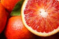 Whole and cut ripe red oranges with green leaf, closeup Royalty Free Stock Photo