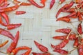 Whole dried red chili or hot pepper top view on natural background with copy space.