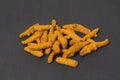 Whole dry turmeric root on grey Royalty Free Stock Photo