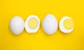 whole eggs and boil egg isolated on yellow background Royalty Free Stock Photo